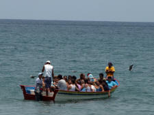 Los Ayalas ferried out to the party boat Bill Bell Photograph