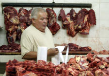 butcher at the Municpal Market Alamos...Bill Bell Photograph