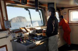Captain, Jose Alfredo Esclante on the Bridge of the Santa Rosalia 